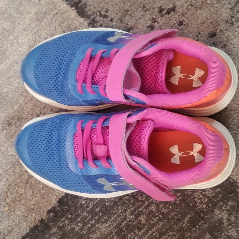 UA under armour shoes size 1 year or 12, uk is 13.5 girls. Pink purple